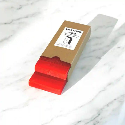 Manubeton Nachfüllwachs "Schokoladentafel" in 500g Verpackung, mit Kürbis-Design auf der Verpackung, für Kerzenherstellung.